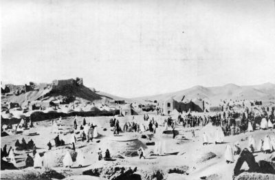 Women Visiting Graves of Relatives, Birjand. (Ruined Fort can be observed on Hill.) Women Visiting Graves of Relatives, Birjand. (Ruined Fort can be observed on Hill.)