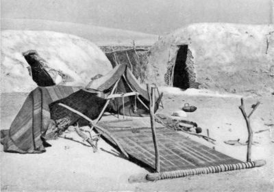 Beluch Huts and Weaving Loom. Beluch Huts and Weaving Loom.