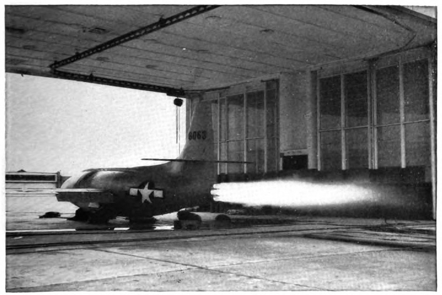 Picture of an airplane on the ground with a plume coming ouf of its back end