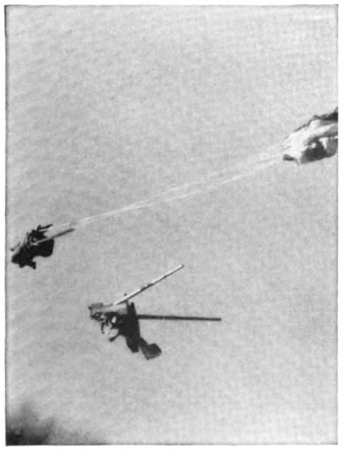 The seat falling away from an object attached to a parachute