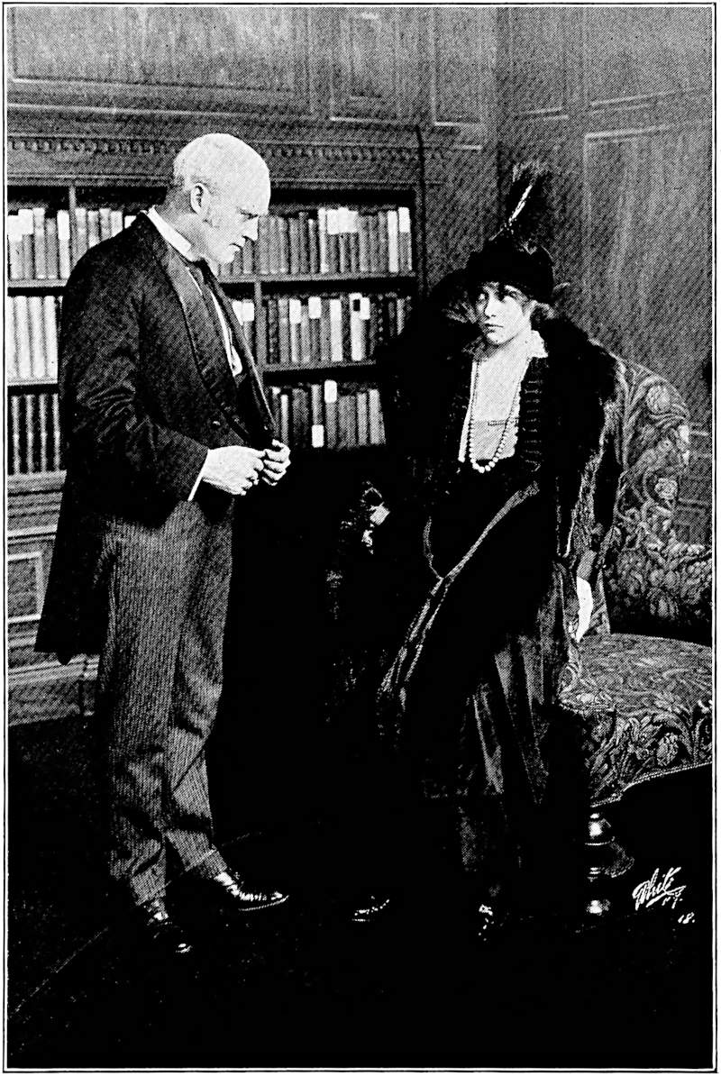 Walters stands in front of Judy, who leans nervously against the armchair
