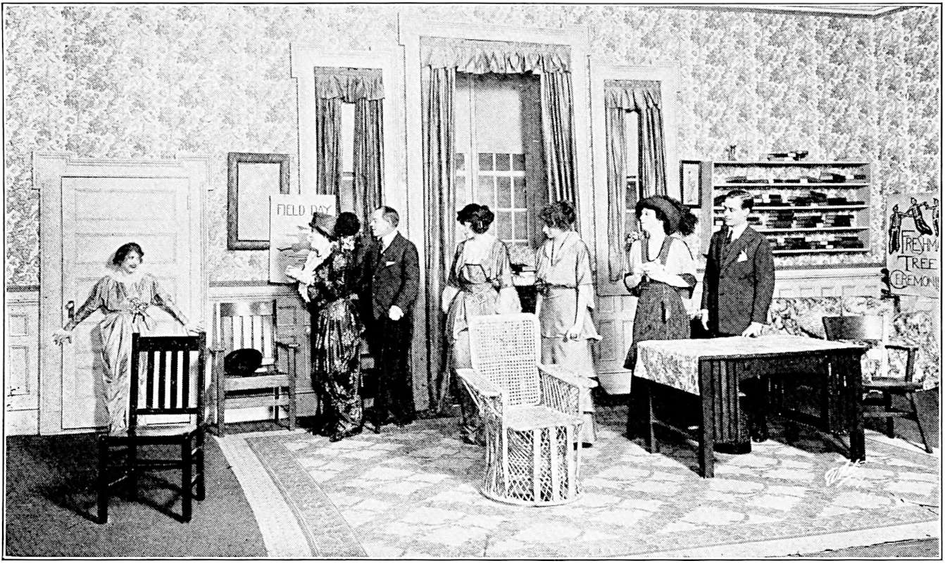Judy leans against the closed door of the room as the others look at her from across the stage.