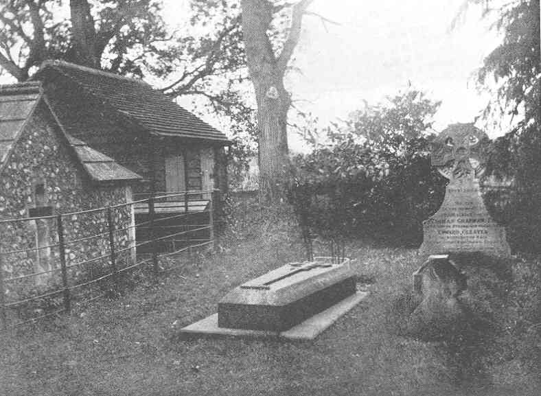 Edward FitzGerald’s gravestone in Boulge  churchyard; at the head of the grave is a rose bush raised from  seed brought from Omar’s tomb