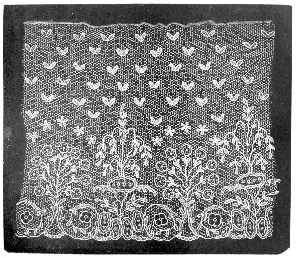 Lace with flowering plants and small     butterflies