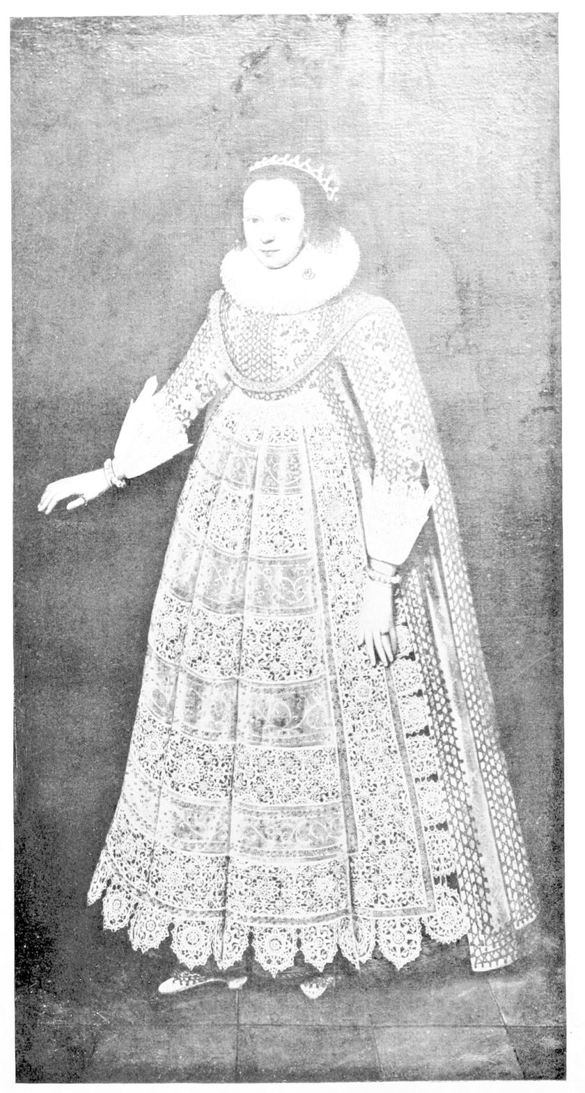 Young woman wearing full length lace     dress.