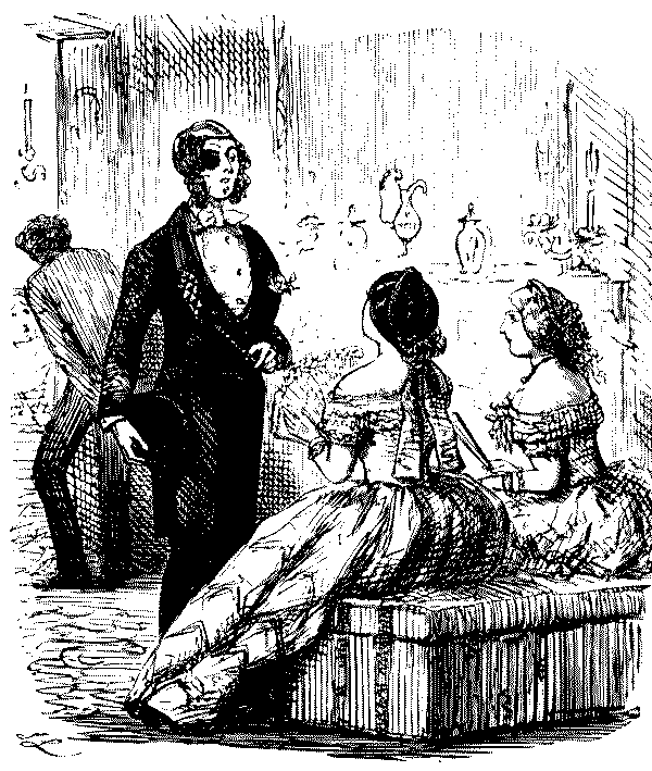 Man speaking to two women.