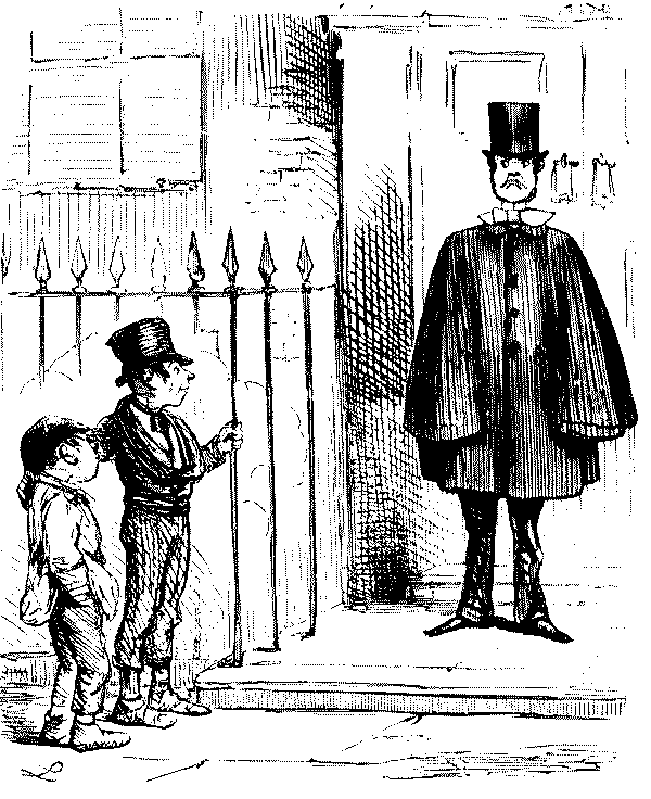 Boys talking about smartly dressed man.