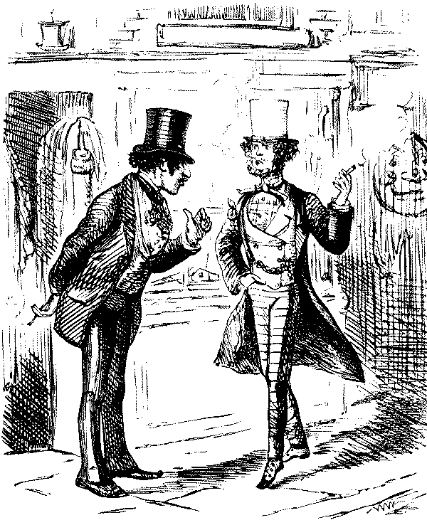 Tailor speaking to smartly dressed man.