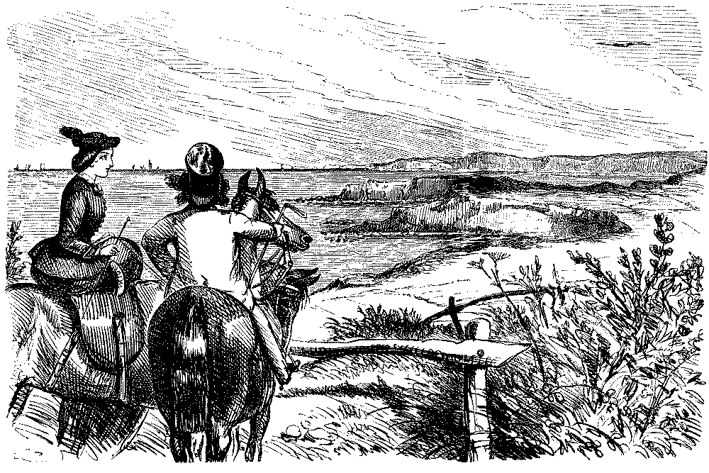 Man and woman horse riders enjoying the scenery.