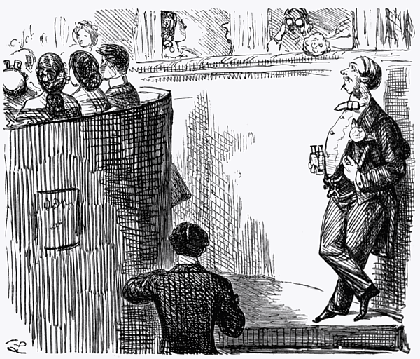 Man looking up at the ladies in the box.
