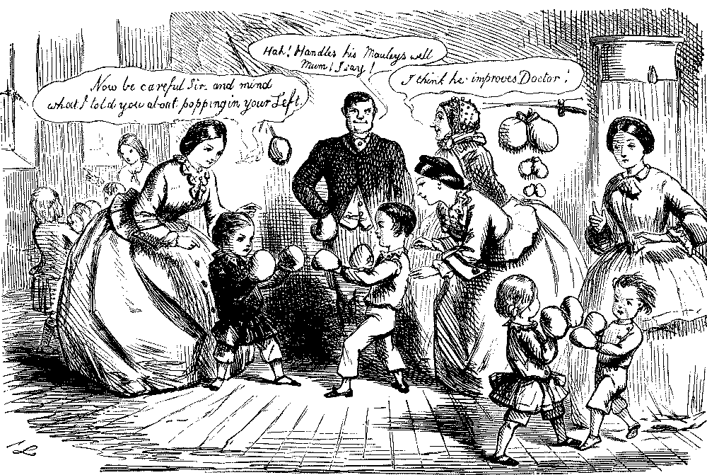 Children sparring wearing boxing gloves.