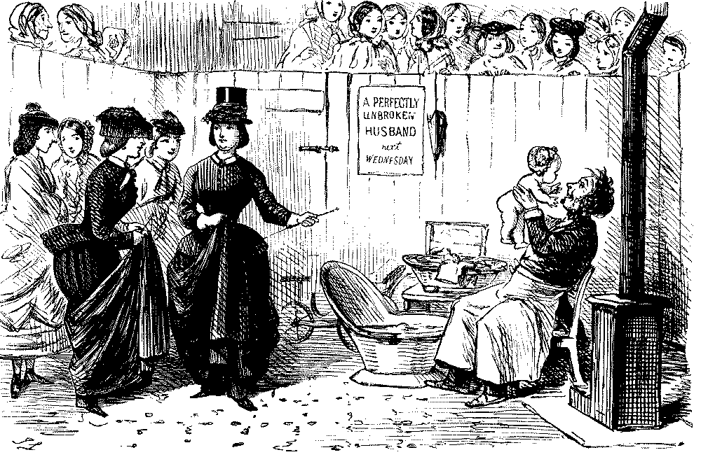 Group of ladies looking at man caring for a baby.