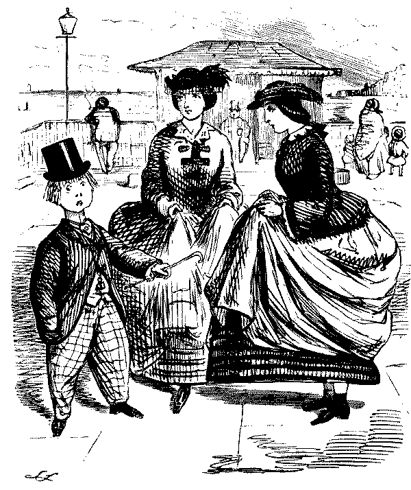 Boy speaking to two ladies.