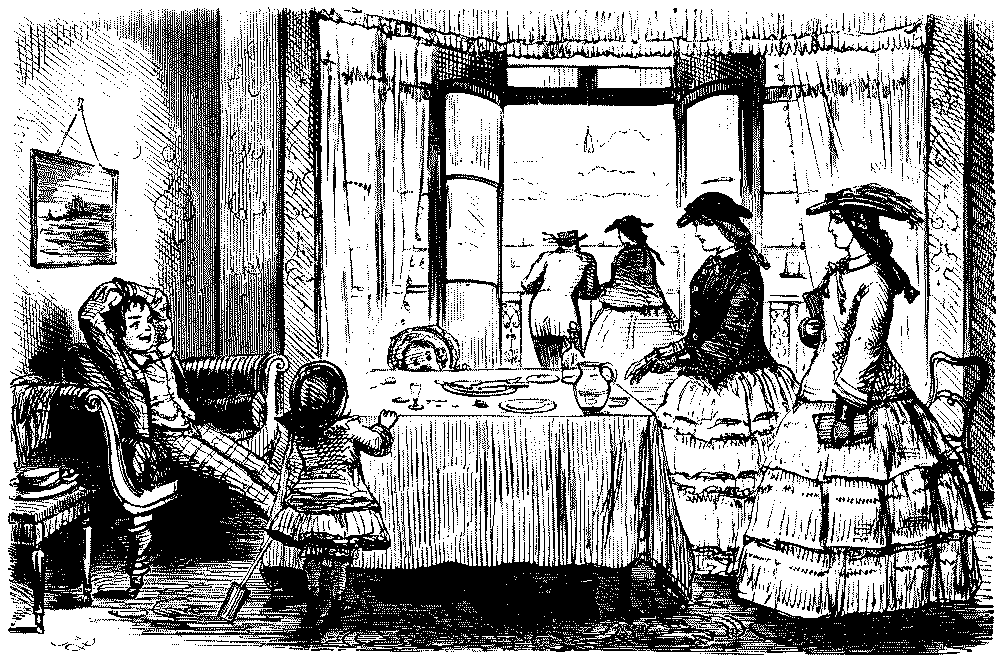 Boy sspeaking to two young ladies,