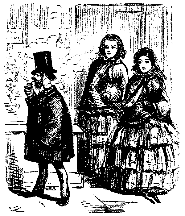 Man walking past two ladies.