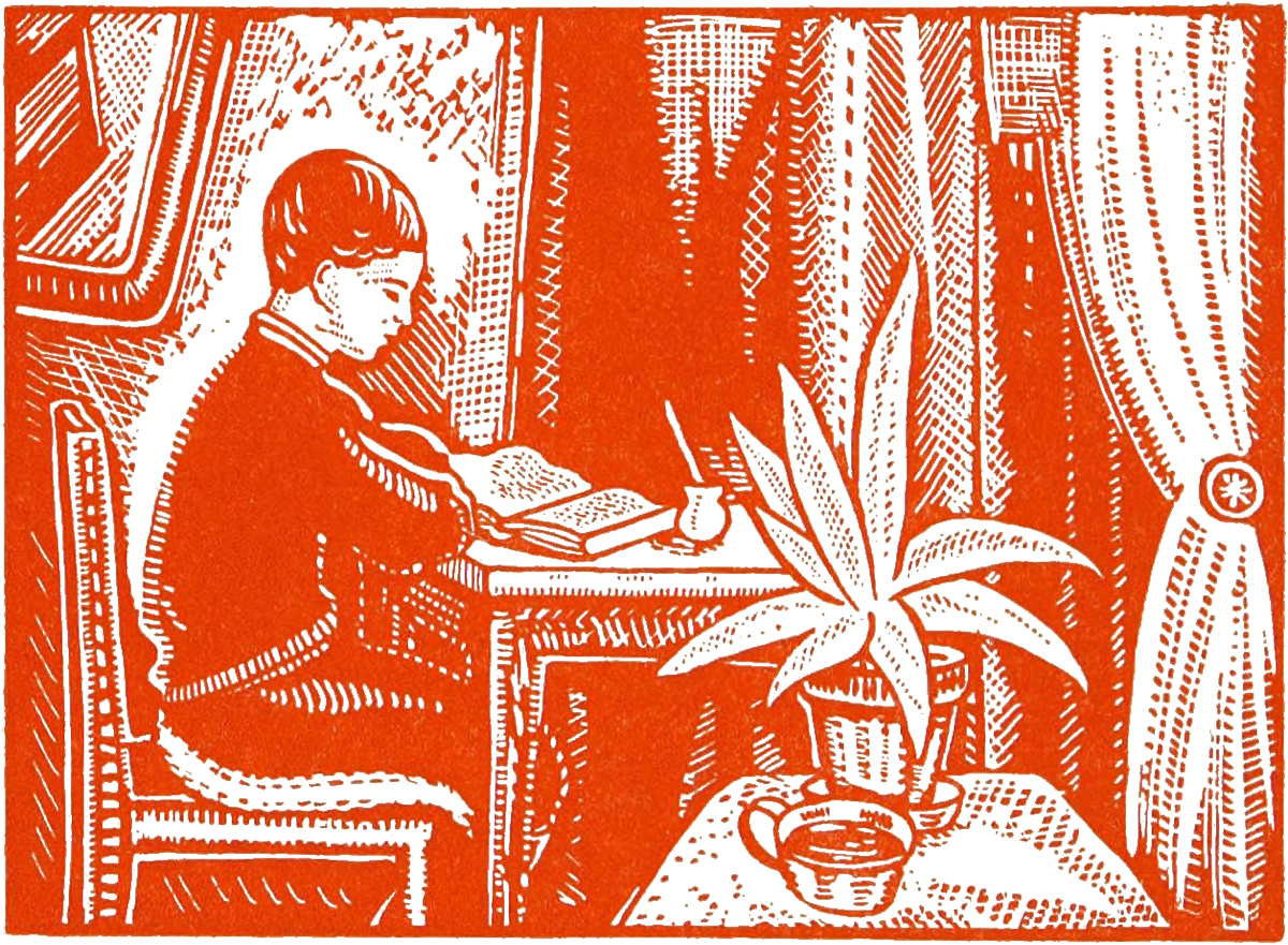 Boy reading at table