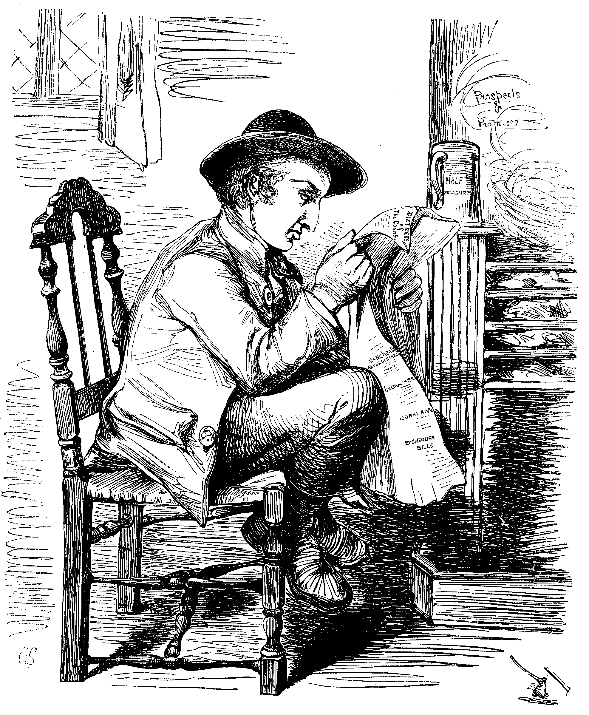 A man sits looking at a piece of paper.