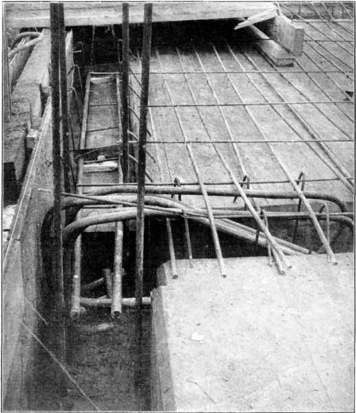 Junction of Beam and Wall Column. Reinforcement in Place in Beam, Lintel, and Slab up to Beam. Note End Anchorage of Beam Bars. Junction of Beam and Wall Column. Reinforcement in Place in Beam, Lintel, and Slab up to Beam. Note End Anchorage of Beam Bars.