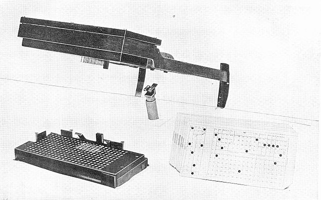 PIN-BOX AND MERCURY CUPS. Details of mechanism which almost magically detects mistakes in any census card. (Courtesy of the Bureau of the Census.)