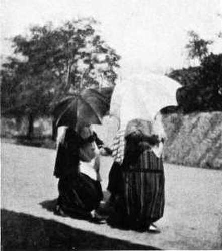 CHRISTIAN WOMEN HIDING FROM THE PHOTOGRAPHER. CHRISTIAN WOMEN HIDING FROM THE PHOTOGRAPHER.