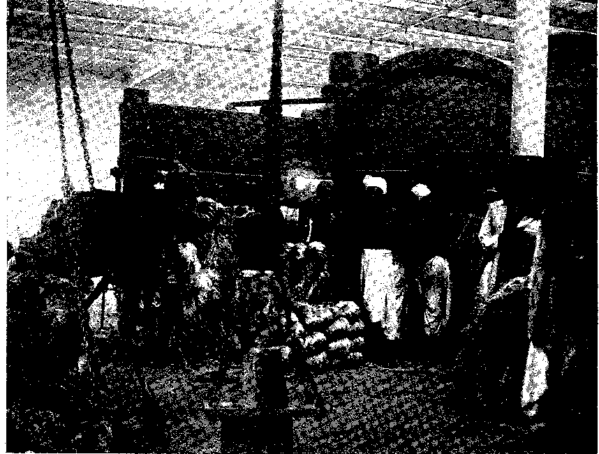 FIG. 5 NATIVES BAILING JUTE FIBRE IN A WATSON-FAWCETT CYCLONE PRESS