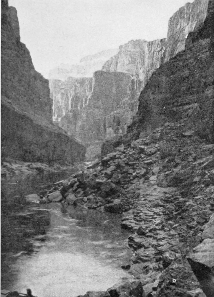 The river makes an 'S' curve through the high canyon walls, most of which are in the shadows.