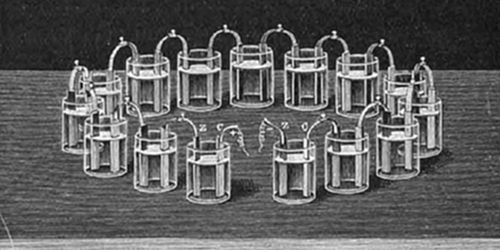 A crown of cups battery — a series of glass cells containing metal electrode pairs linked in a circuit — Volta's alternative arrangement to the stacked pile for generating continuous electric current.