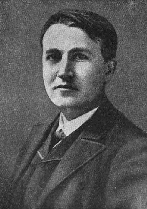 photograph of a clean-shaven man in late 19th-century dress — consistent with portraits of Thomas Edison, inventor of the phonograph, incandescent light bulb, and numerous other devices.